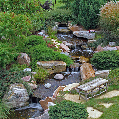 An aerial shot of a pondless waterfall