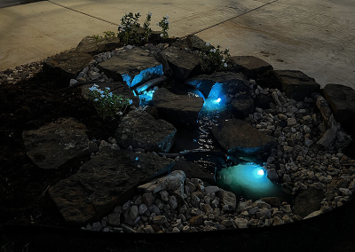 A pondless waterfall with blue lights