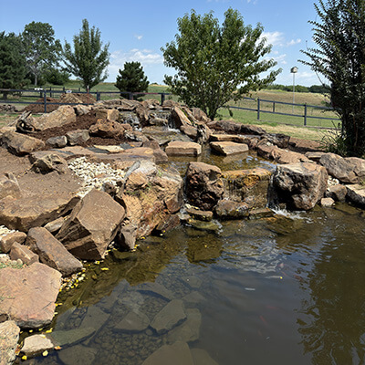 A waterfall and pond 