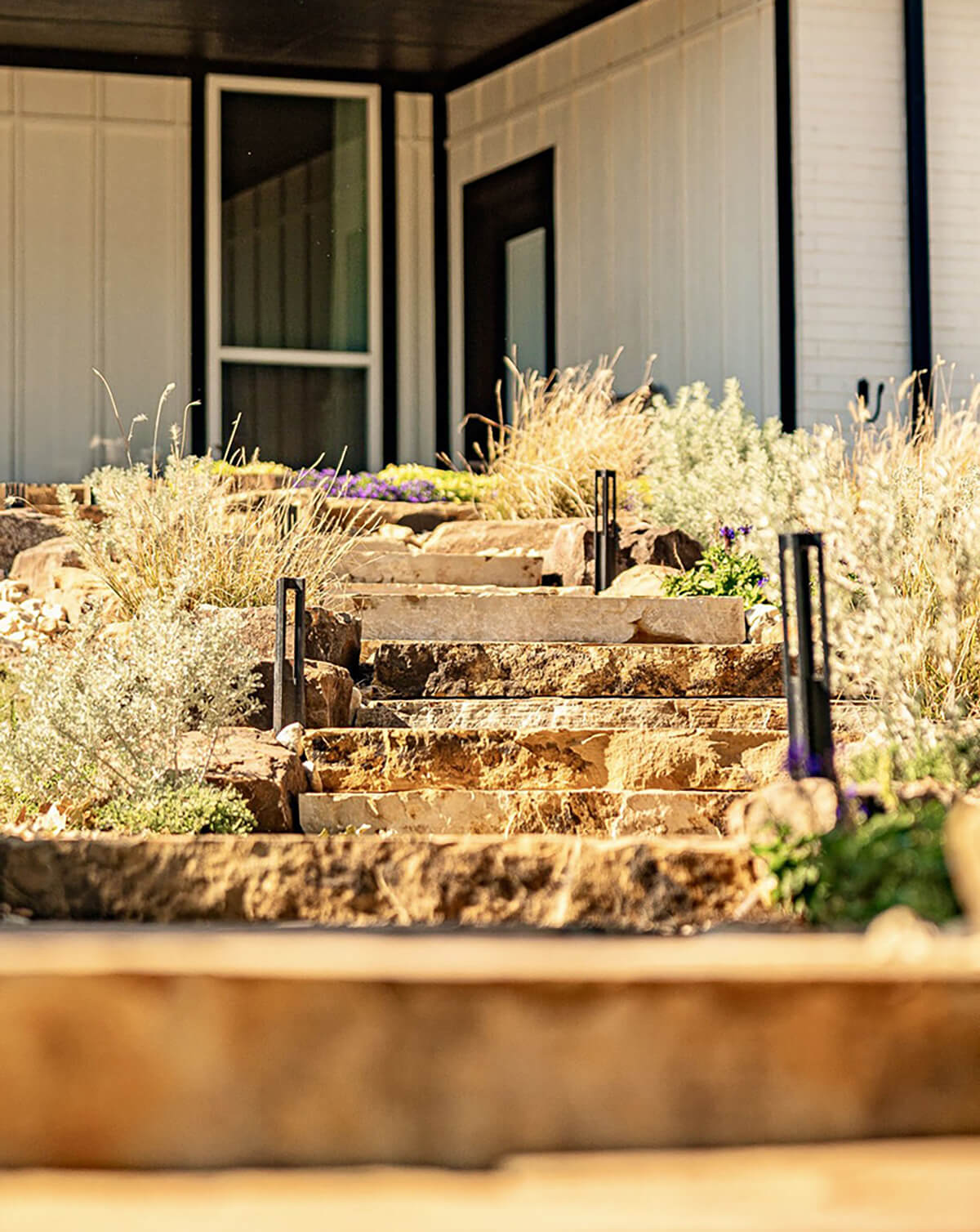 Outdoor lighting features surrounding a stone staircase